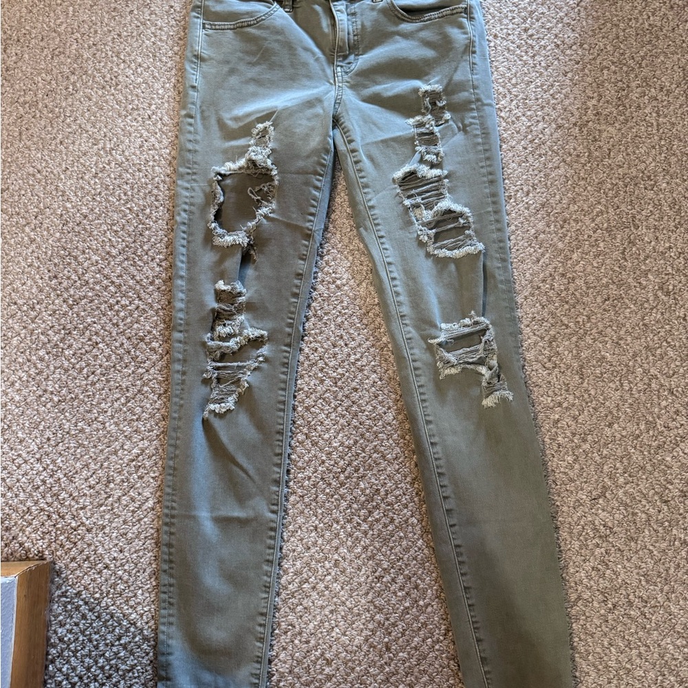 American Eagle Olive green Super Stretch jeggings with distressing! NWOT!
